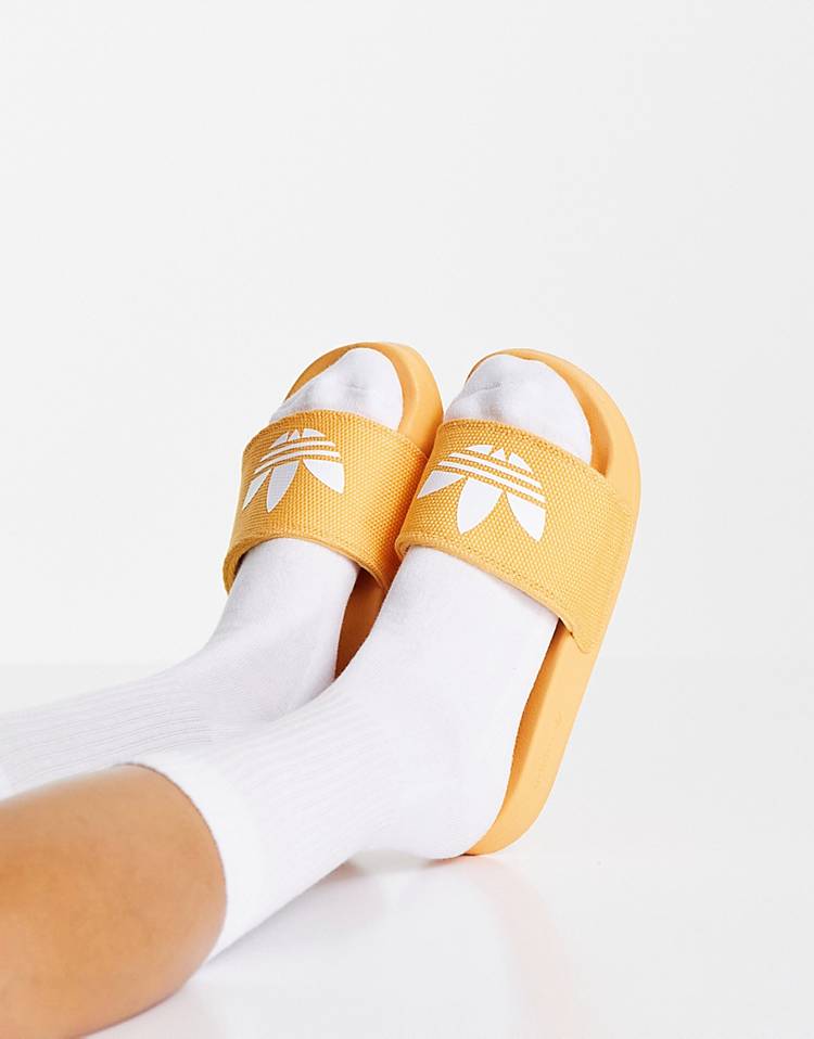 adidas Originals Adilette Lite slides in hazy orange